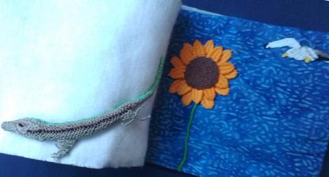 On the left is a needlelace lizard and on the right there's a large sunflower and a small gull